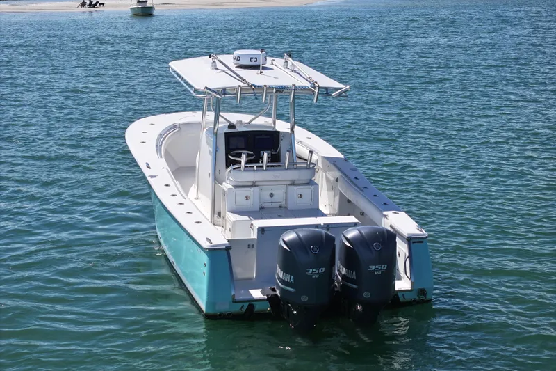 Slide: The Image of 2006 Southport 28 Center Console boat with twin Yamaha 350 engines on water. - 4