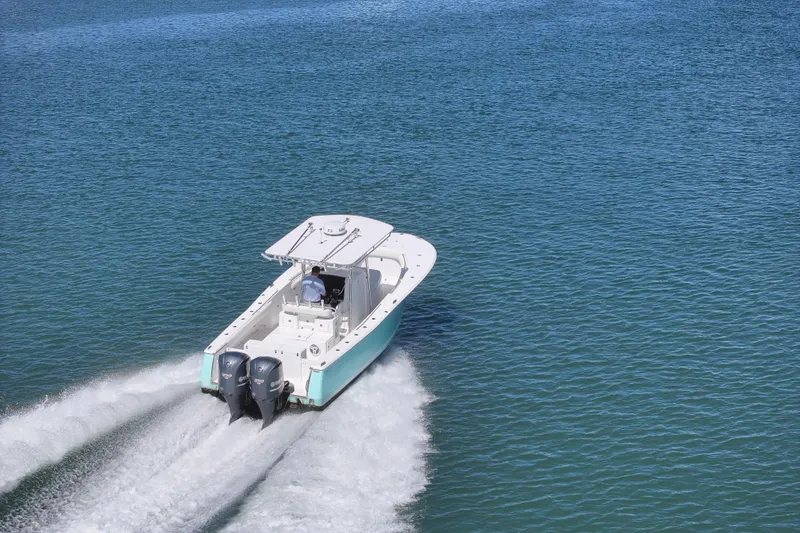 Slide: The Image of 2006 Southport 28 Center Console boat cruising on open water. - 9