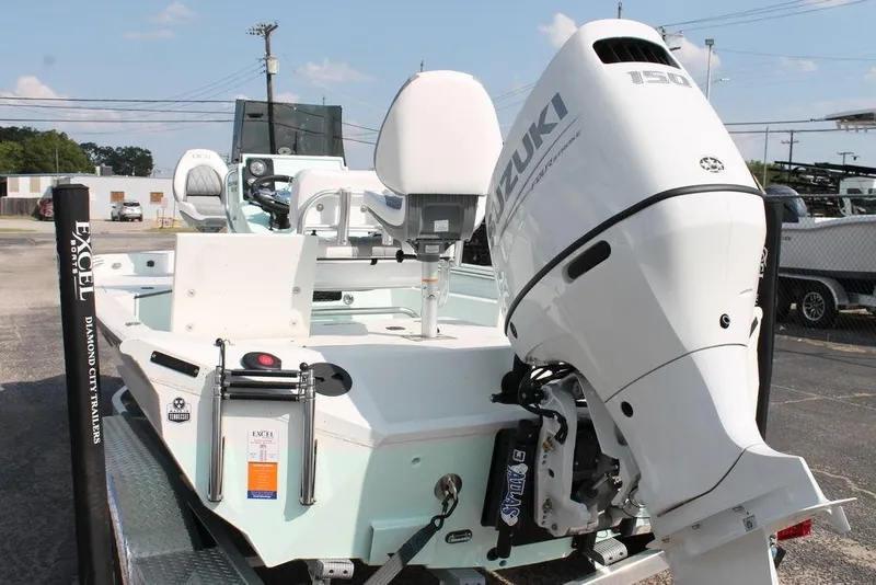 Slide: The Image of 2026 Excel Bay Pro Elite 203 boat with Suzuki 150 engine on trailer. - 5