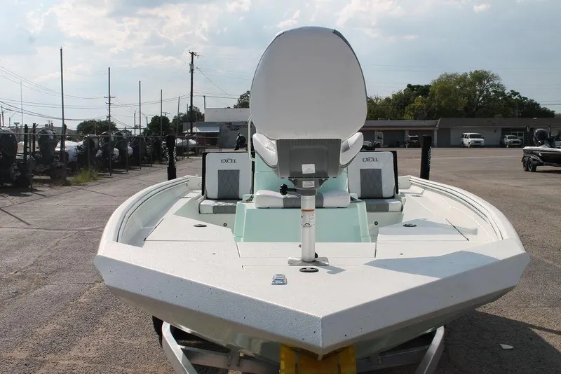 Slide: The Image of 2026 Excel Bay Pro Elite 203 boat, front view in a parking lot. - 6