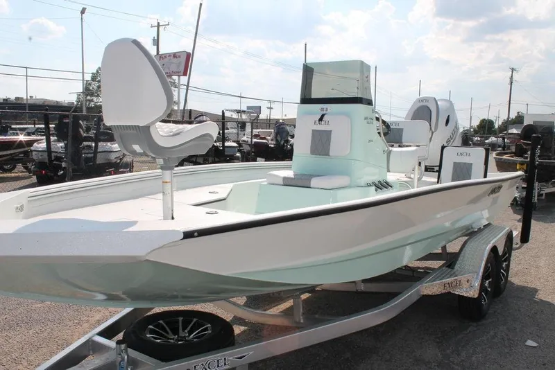 Slide: The Image of 2026 Excel Bay Pro Elite 203 boat on trailer, featuring sleek design and modern seating. - 7