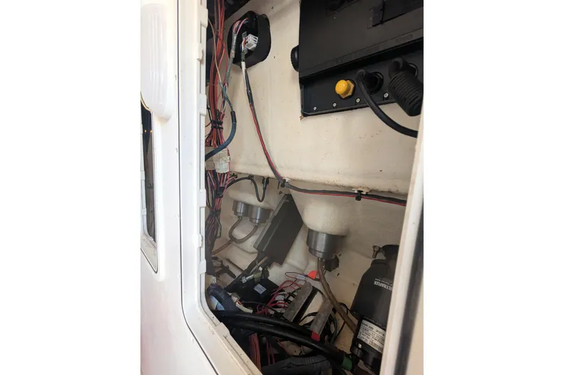 Slide: The Image of Interior view of 2016 Sailfish 240 CC boat showing wiring and components. - 9