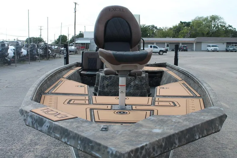 Slide: The Image of 2026 Excel Bay Pro Elite 203 boat with cushioned seating and spacious deck. - 4