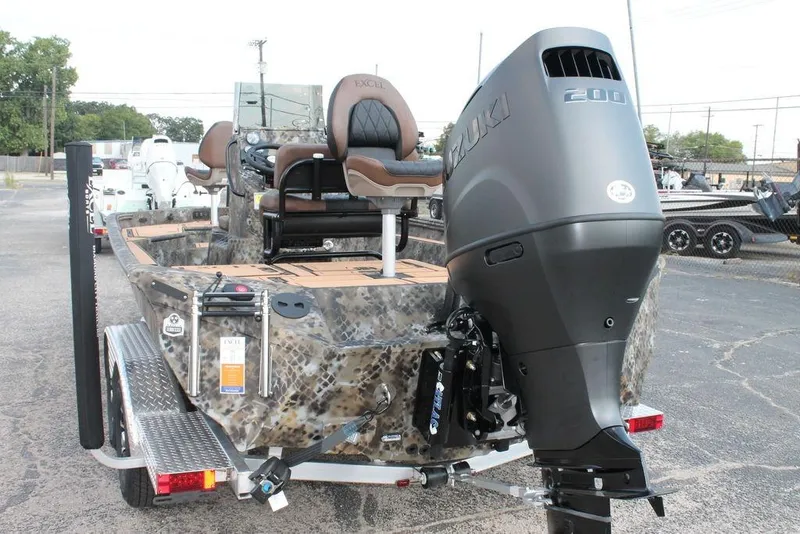 Slide: The Image of 2026 Excel Bay Pro Elite 203 boat with Suzuki 200 outboard motor, parked on trailer. - 5