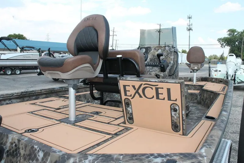 Slide: The Image of 2026 Excel Bay Pro Elite 203 boat with camo design and comfortable seating. - 7