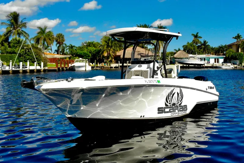 The Image of 2022 Wellcraft 242 Fisherman boat on water, sunny day, palm trees in background. - 0