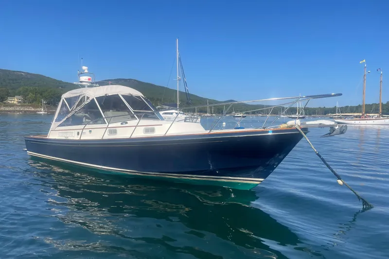The Image of 1998 Little Harbor WhisperJet 36 boat anchored in scenic coastal waters. - 0
