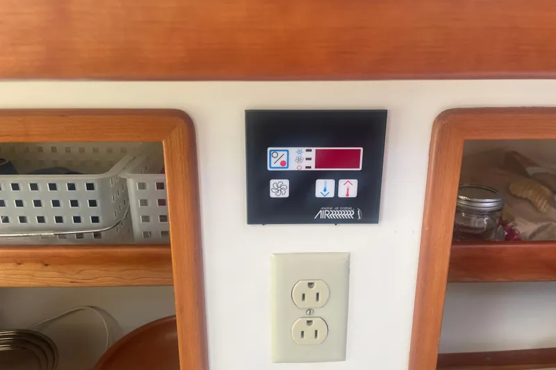 Slide: The Image of Stainless steel sink and faucet in 1998 Little Harbor WhisperJet 36 boat kitchen. - 12