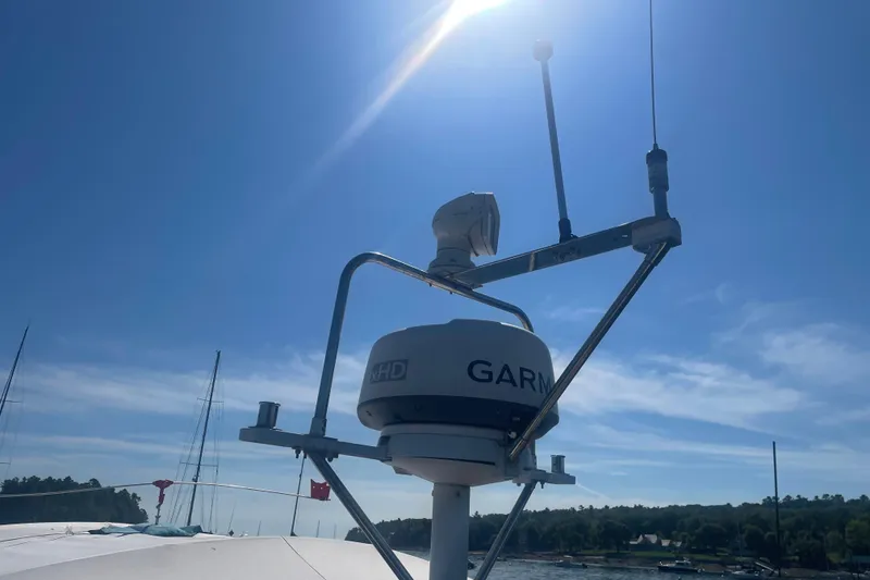 Slide: The Image of 1998 Little Harbor WhisperJet 36 boat on calm water under clear sky. - 4