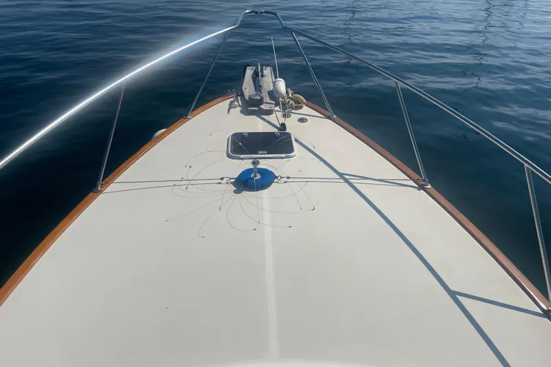 Slide: The Image of Bow view of 1998 Little Harbor WhisperJet 36 on calm water. - 5