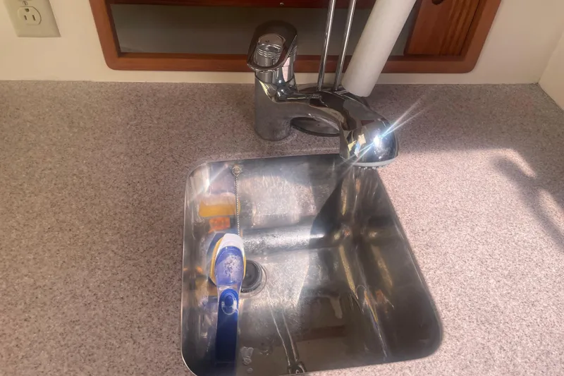 Slide: The Image of Bow of 1998 Little Harbor WhisperJet 36 near buoy on calm water. - 9