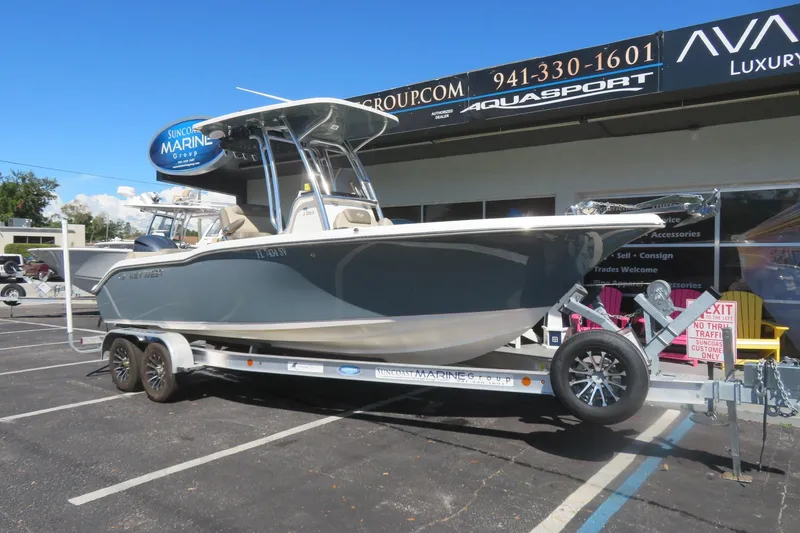 Slide: The Image of 2021 Key West 239 FS boat on trailer at Suncoast Marine Group dealership. - 2