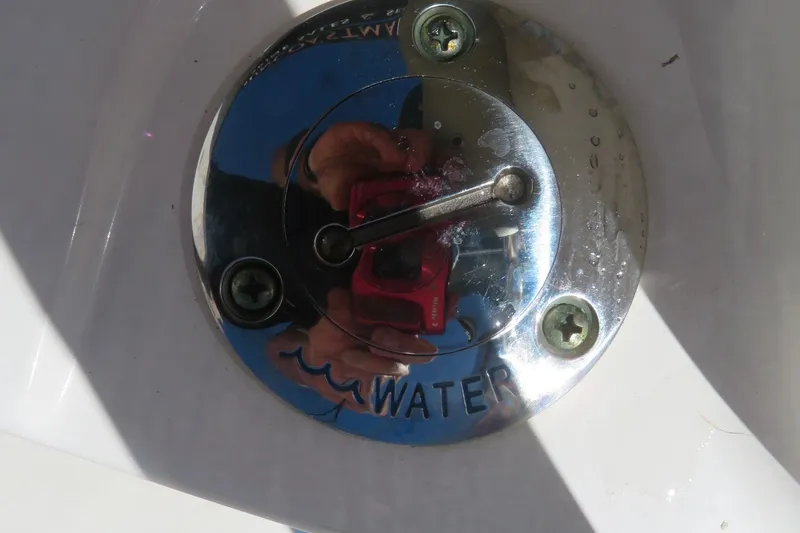 Slide: The Image of Close-up of a 2021 Key West 239 FS boat water access panel. - 22