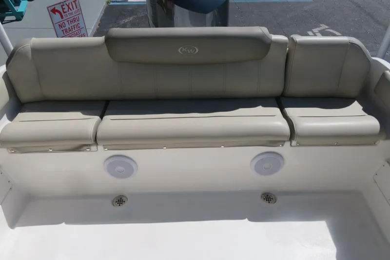 Slide: The Image of 2021 Key West 239 FS boat seating with beige cushions and built-in speakers. - 28