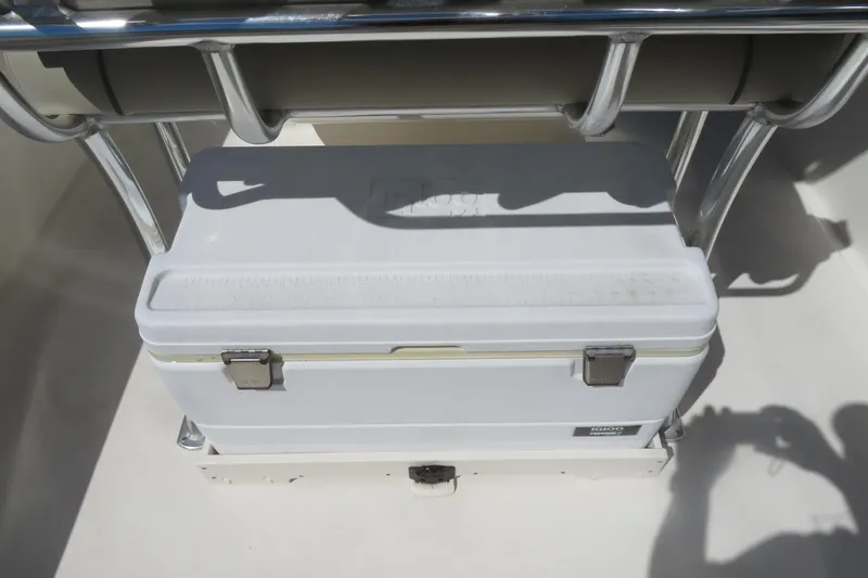 Slide: The Image of White cooler on a 2021 Key West 239 FS boat, secured under metal frame. - 29