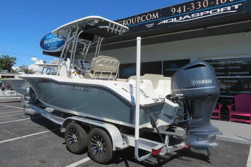Slide: The Image of 2021 Key West 239 FS boat with Yamaha engine on trailer at dealership. - 3