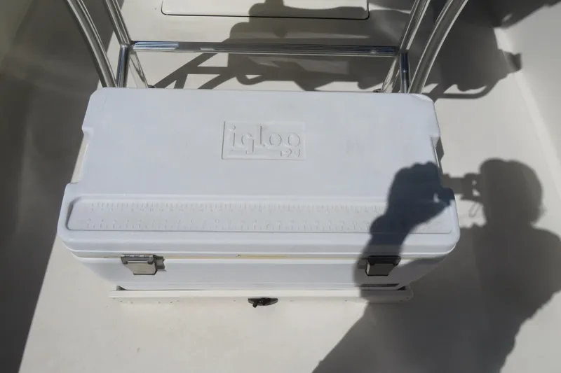 Slide: The Image of White Igloo cooler on 2021 Key West 239 FS boat deck, shadow visible. - 30