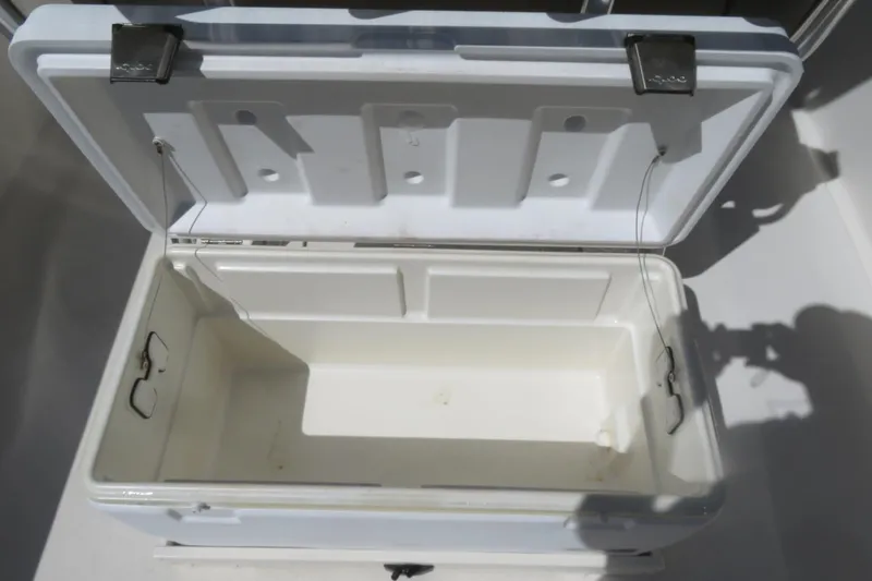 Slide: The Image of Open storage compartment on 2021 Key West 239 FS boat, showing interior details. - 31