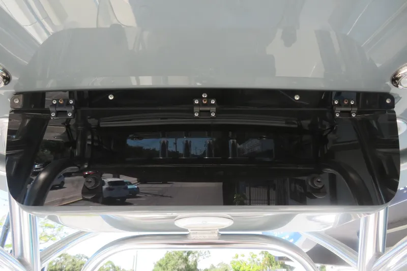 Slide: The Image of 2021 Key West 239 FS boat console with mounted electronics and reflective surface. - 40
