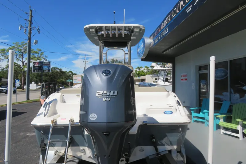 Slide: The Image of 2021 Key West 239 FS boat with Yamaha 250 V6 engine at a marine dealership. - 9