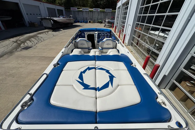 Slide: The Image of 2008 Fountain 35 Lightning boat with blue and white interior, parked at a marina. - 11