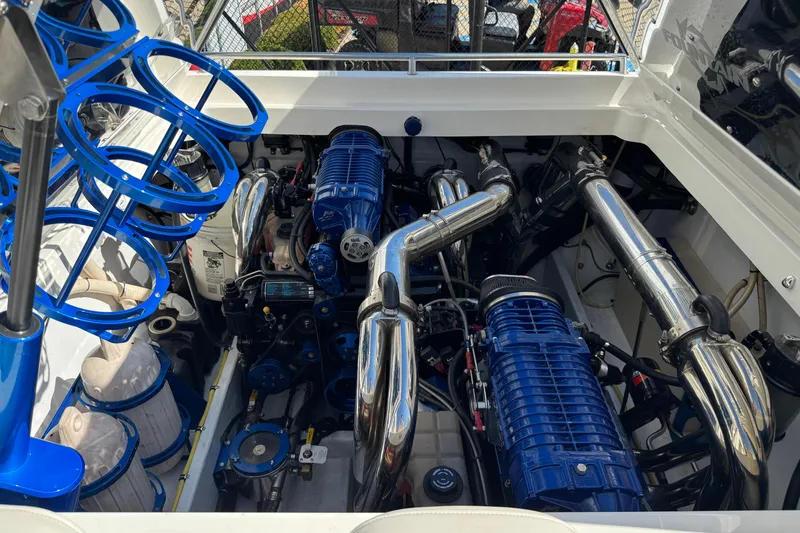 Slide: The Image of Engine compartment of a 2008 Fountain 35 Lightning boat with blue and chrome components. - 16