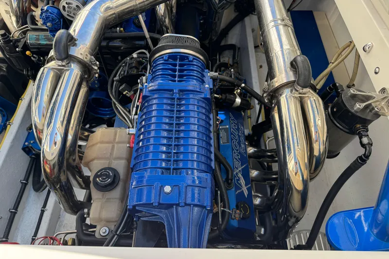 Slide: The Image of Engine of 2008 Fountain 35 Lightning boat with blue and chrome components. - 17