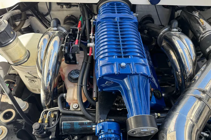 Slide: The Image of Engine of 2008 Fountain 35 Lightning boat with blue supercharger and chrome components. - 18