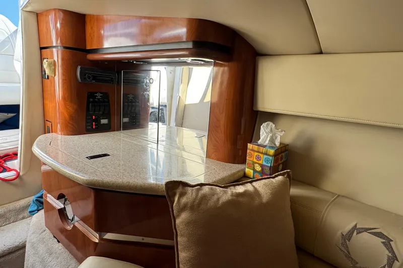 Slide: The Image of 2008 Fountain 35 Lightning boat interior with wood accents and seating area. - 26