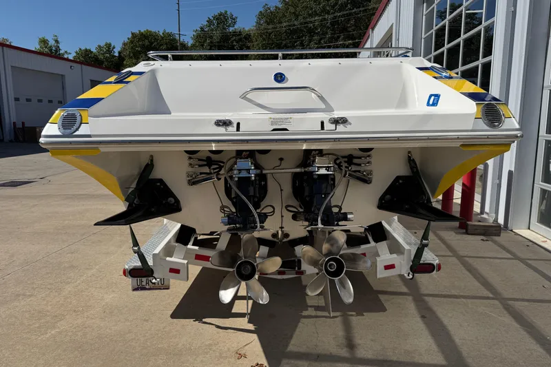 Slide: The Image of 2008 Fountain 35 Lightning boat on trailer, rear view showing dual propellers. - 7