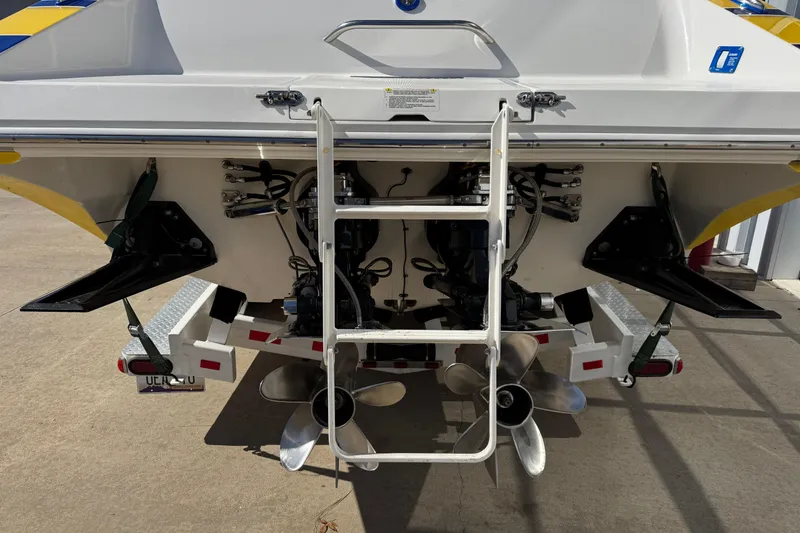 Slide: The Image of Rear view of 2008 Fountain 35 Lightning boat with dual propellers and ladder. - 8