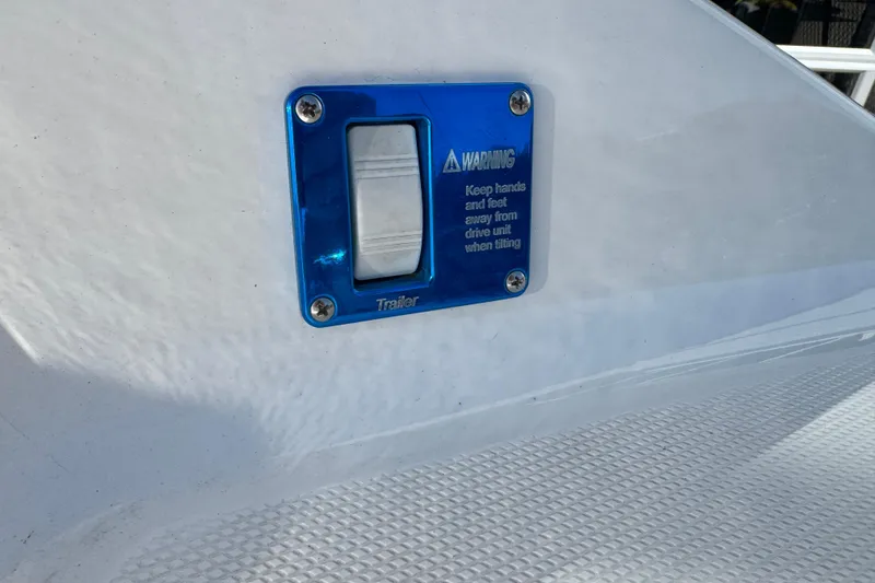 Slide: The Image of Close-up of a 2008 Fountain 35 Lightning boat warning label and switch. - 9