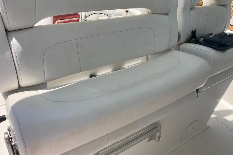 Slide: The Image of White seating on a 2016 Tarpon 326 boat, featuring cushioned upholstery. - 17