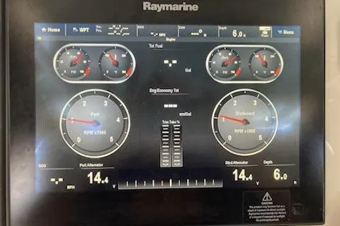 Slide: The Image of Raymarine display showing engine metrics on a 2016 Stamas 326 Tarpon boat. - 25