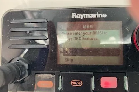 Slide: The Image of Raymarine device on 2016 Stamas 326 Tarpon, prompting for MMSI entry for DSC features. - 29