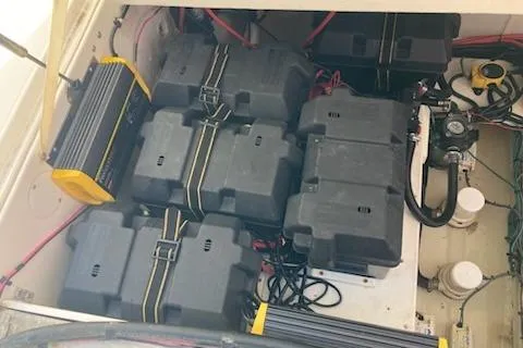 Slide: The Image of Battery compartment of a 2016 Stamas 326 Tarpon boat, featuring multiple secured batteries. - 30