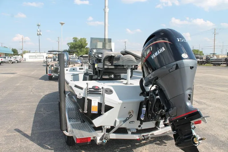 Slide: The Image of 2026 Excel Bay Pro Elite 203 boat with Yamaha 150 engine in parking lot. - 3