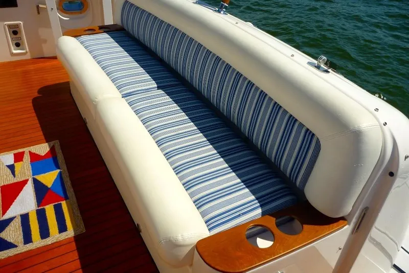 Slide: The Image of Luxury seating on 2006 Tiara 44' Sovran yacht with striped cushions and nautical decor. - 10