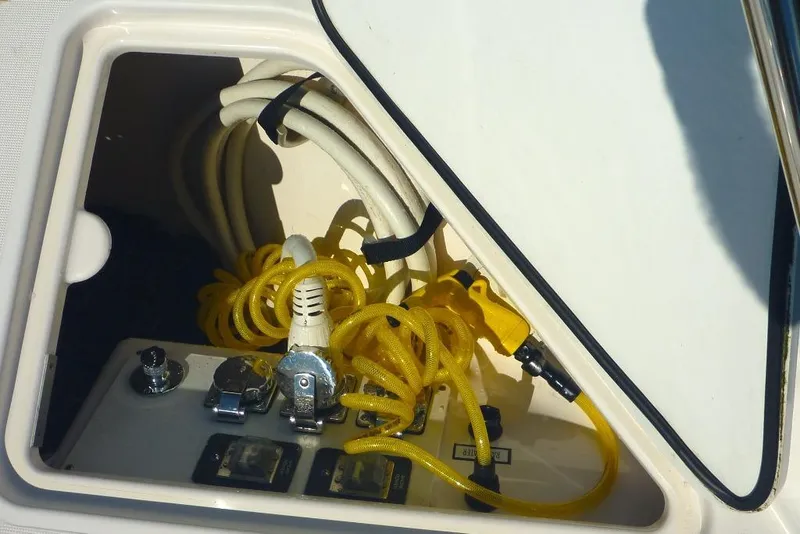 Slide: The Image of Electrical compartment of 2006 Tiara 44' Sovran yacht with yellow cables. - 17