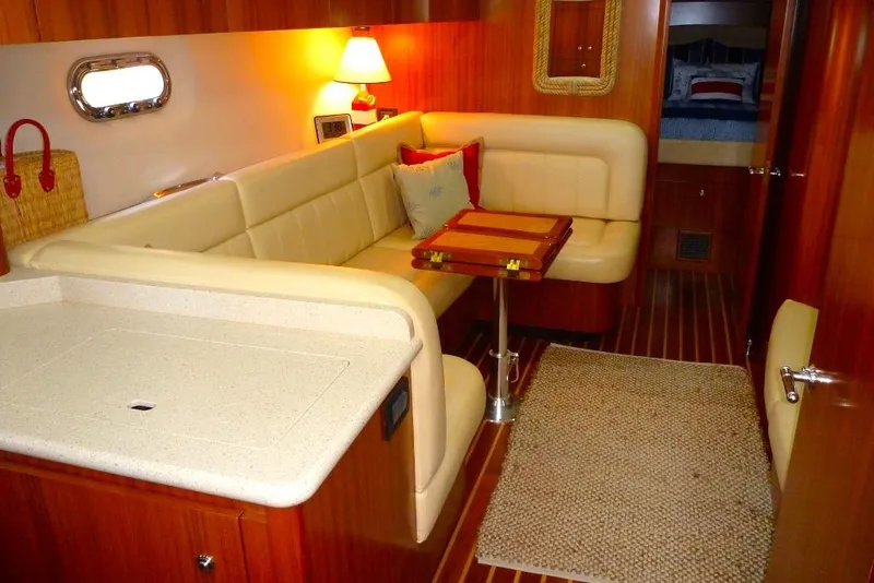 Slide: The Image of Luxurious interior of 2006 Tiara 44' Sovran yacht with cozy seating and elegant decor. - 18