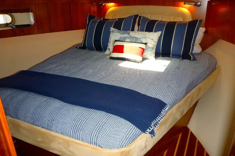 Slide: The Image of Luxurious cabin interior of 2006 Tiara 44' Sovran yacht with cozy bedding. - 22