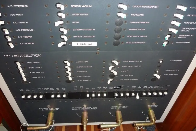 Slide: The Image of Electrical control panel on a 2006 Tiara 44' Sovran yacht, featuring various switches and labels. - 34