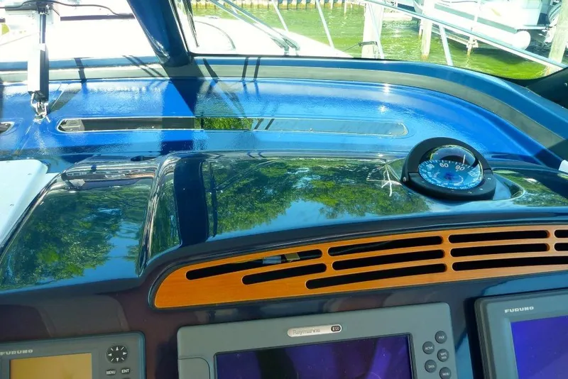 Slide: The Image of 2006 Tiara 44' Sovran yacht dashboard with navigation instruments and compass. - 37