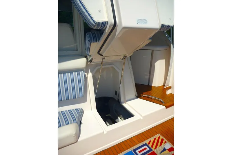 Slide: The Image of 2006 Tiara 44' Sovran yacht interior with striped seating and wooden flooring. - 38