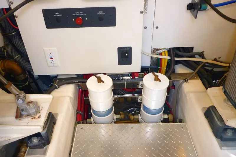 Slide: The Image of Engine room of 2006 Tiara 44' Sovran yacht with filters and control panel. - 40