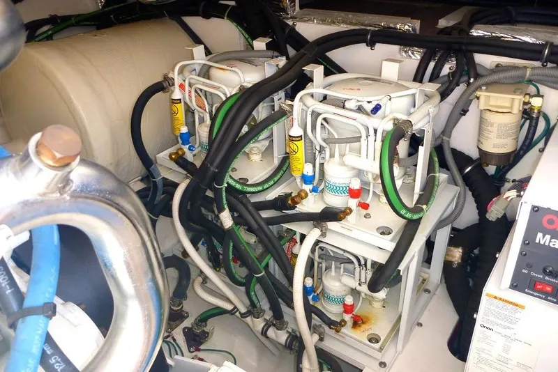 Slide: The Image of Engine room of 2006 Tiara 44' Sovran yacht with complex machinery and wiring. - 44