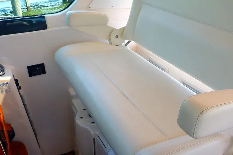 Slide: The Image of Luxurious white seating on 2006 Tiara 44' Sovran yacht, showcasing comfort and elegance. - 6