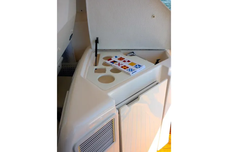 Slide: The Image of 2006 Tiara 44' Sovran yacht interior with nautical flag chart on counter. - 8
