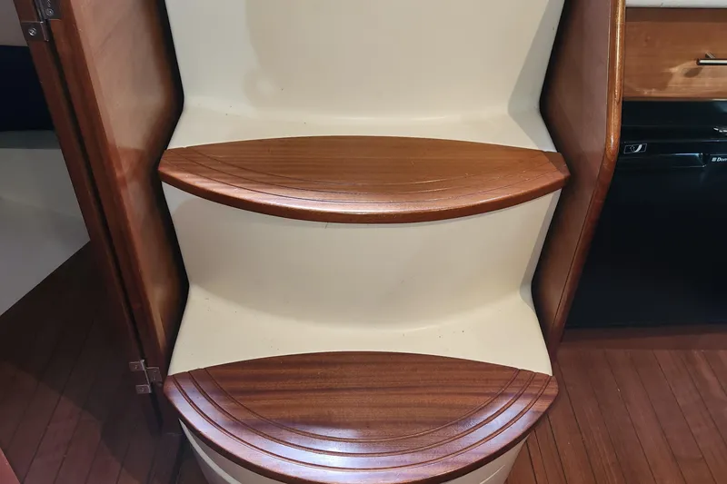 Slide: The Image of Wooden steps inside 2012 Hunter e 33 sailboat cabin. - 10