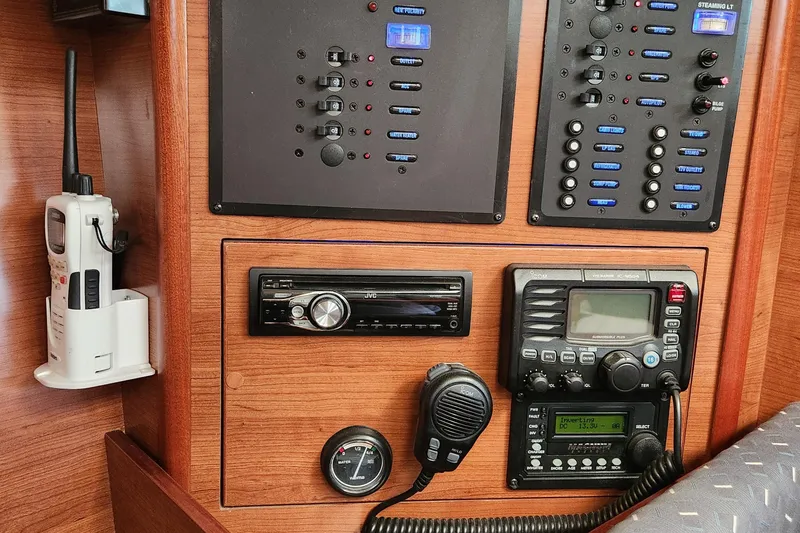 Slide: The Image of Control panel of a 2012 Hunter e 33 sailboat with radio and navigation equipment. - 12